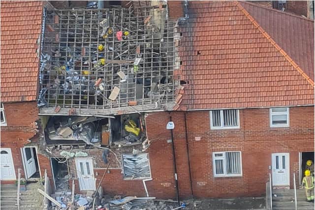Emergency services are at the scene of a suspected gas explosion.