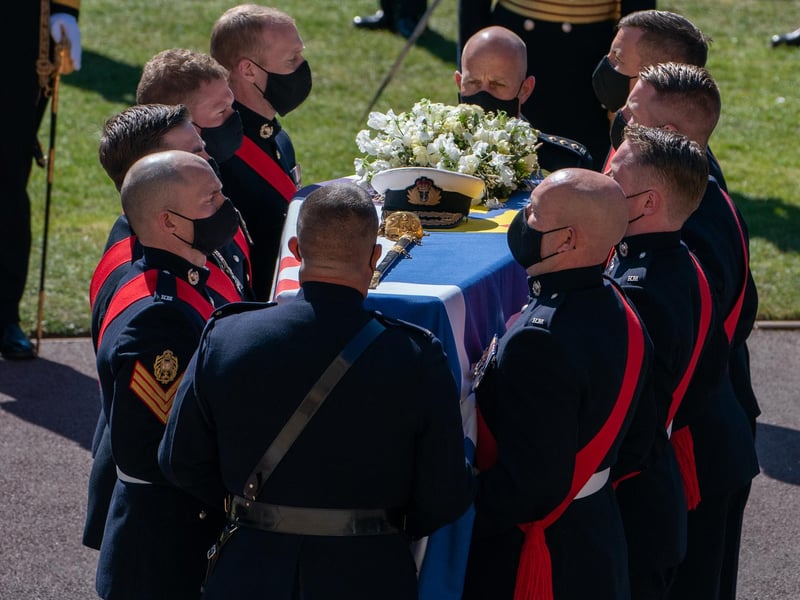 The Duke of Edinburgh's coffin, covered with his Personal Standard, is carried into St George's Chapel, Windsor Castle, Berkshire, ahead of the funeral of the Duke of Edinburgh.
