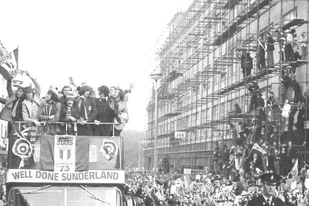 Fans found any vantage point they could to watch the FA Cup parade.