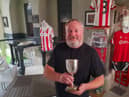 Fans Museum founder Michael Ganley with the 138 year-old trophy.