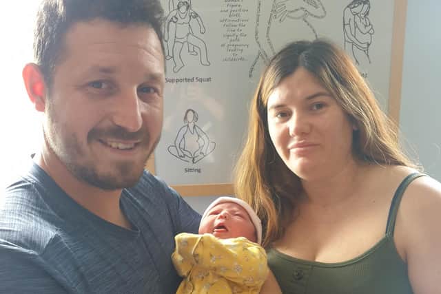Damien Brown and Leanne Noble with baby Iyla Brown.
