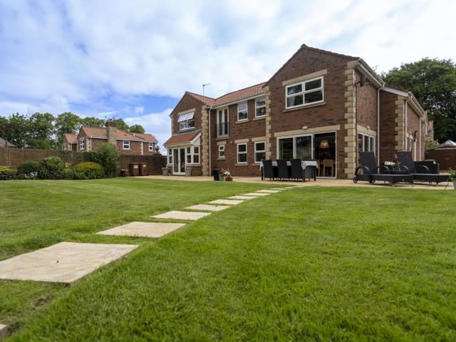 Externally the property is set on approximately 1/3 of an acre having a front paved driveway to access the garage.