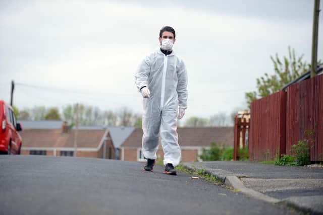 Pro boxer Tommy Ward prepares to walk a 30-mile charity walk in PPE.