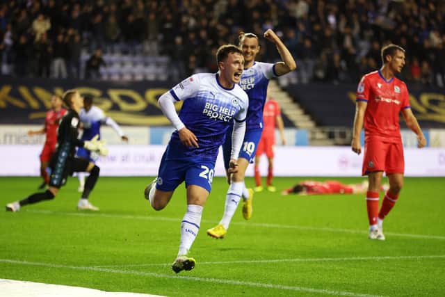 WIGAN, ENGLAND - OCTOBER 11: Nathan Broadhead of Wigan Athletic celebrates after scoring their sides first goal during the Sky Bet Championship between Wigan Athletic and Blackburn Rovers at DW Stadium on October 11, 2022 in Wigan, England. (Photo by Clive Brunskill/Getty Images)