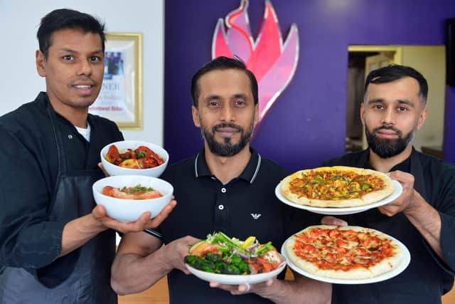 From left chef Syed Imdad, manager Kowsar Miah and curry pizza chef Rasser Miah.