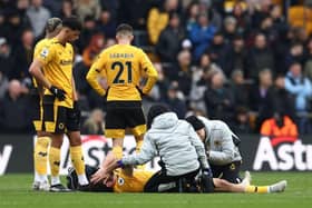 Diego Costa was stretchered off against Tottenham Hotspur during Wolves' last Premier League match (Photo by DARREN STAPLES/AFP via Getty Images)