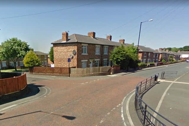 Man arrested after gang of men smash windows on houses and car in street