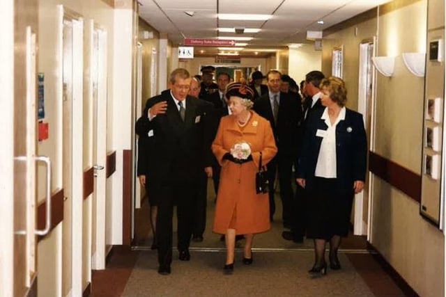 Sheila Ford, right, who spent 20 years as Head of Midwifery, accompanies the Queen during a tour of maternity services in the Chester Wing.