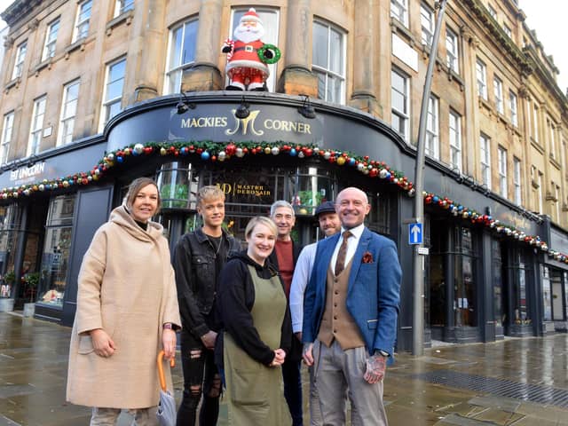 Independent traders ready for Christmas at Mackie's Corner. From left: Helen Collinson from Bou-Chique, Brad Draper from Black Door Hairdressers, Amanda Martin from Fat Unicorn, Harry Collinson from Cafe 1851, Kris Avery and Simon Whitaker from Master Debonair.