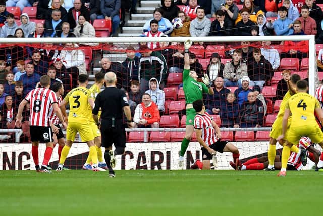 Anthony Patterson makes a strong save from Ched Evans