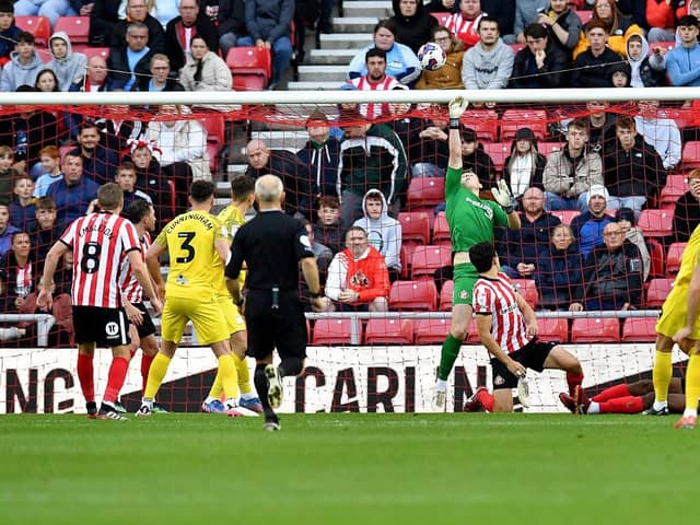 Anthony Patterson makes a strong save from Ched Evans