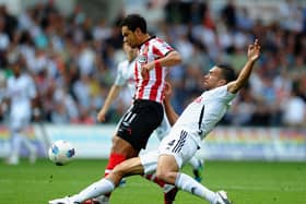 SWANSEA, WALES - AUGUST 27: Keiran Richardson of Sunderland battles for the ball with Steven Caulker of Swansea City during the Barclays Premier League match between Swansea City and Sunderland at Liberty Stadium on August 27, 2011 in Swansea, Wales.  (Photo by Laurence Griffiths/Getty Images)