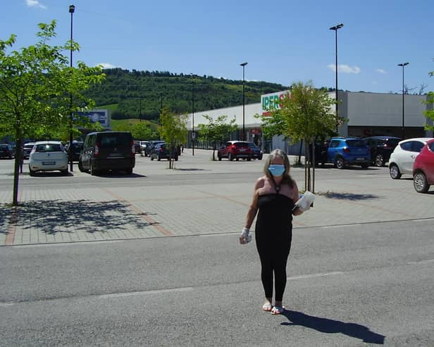 Sandra pictured on a shopping trip in her face mask.