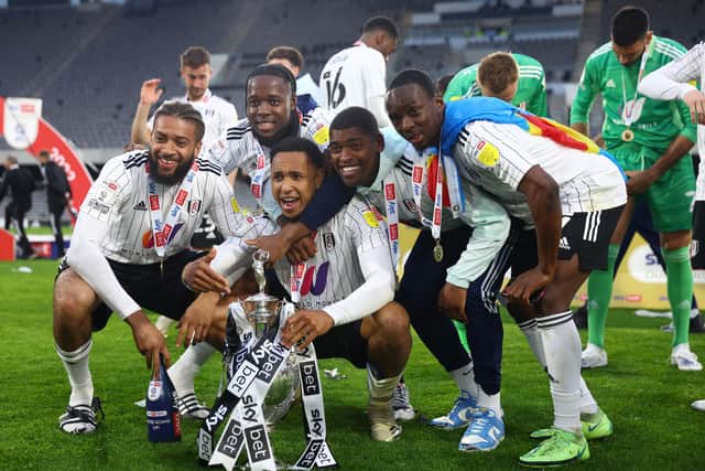 Michael Hector (furthest left), Joshua Onomah, Kenny Tete, Ivan Cavaleiro and Neeskens Kebano of Fulham celebrate winning the Championship.