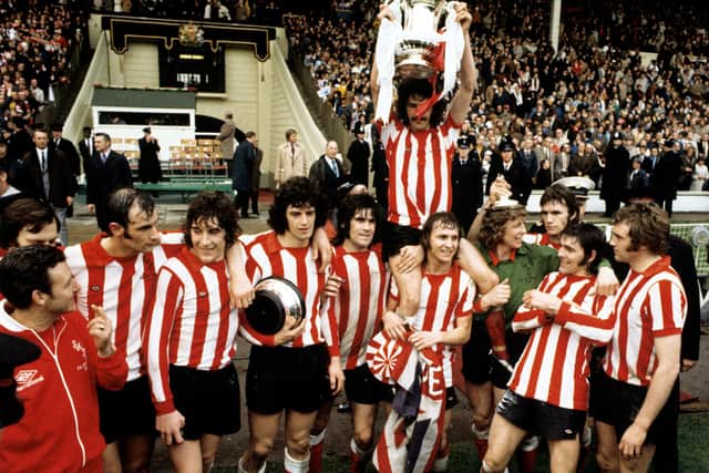 Sunderland's captain Bobby Kerr held aloft by his teammates Billy Hughes and goalkeeper Jim Montgomery after their FA Cup Final victory against Leeds United at Wembley Stadium. PA Photo.