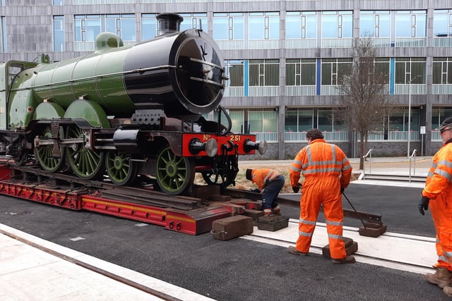 Workers prepare to move engine number 251 off the lorry outside Doncaster museum