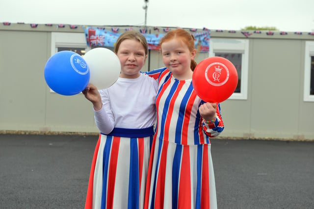 Burnside Academy sisters Emily Raine, 11 and Anna Raine, 9, arrived in Union Jack dresses made by their mother.