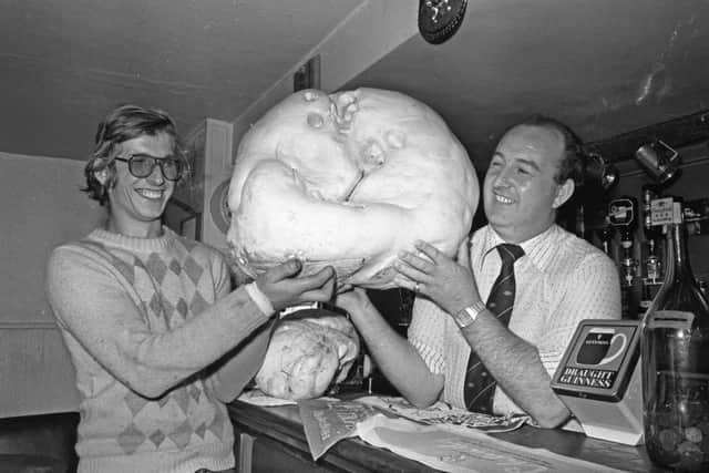 The giant puff ball at the Staplyton Arms public house, Hawthorn with Geoffrey Tate, local farmer and Kenneth Rowe in the picture.