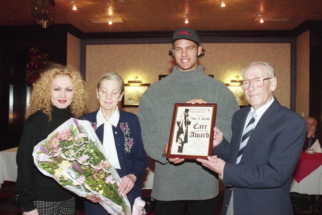 Proud pensioner Tommy Reilly of Hylton Castle won the hearts of Sunderland people by tackling two thugs in 1995. TV Gladiator Hunter presented Tommy and his wife, Florence with a certificate and flowers at a special Christmas dinner organised by the city's Lazarus Foundation.