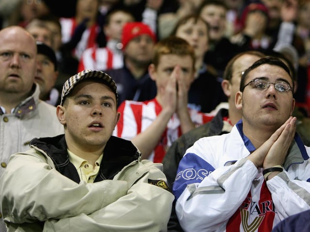 Fans of Sunderland praying for the final whistle during the Premiership match between West Bromwich Albion and Sunderland on January 21, 2006 at the Hawthorns Stadium.