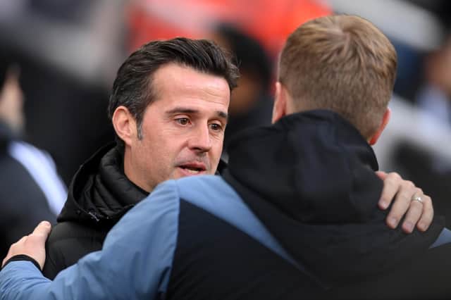 NEWCASTLE UPON TYNE, ENGLAND - JANUARY 15: Marco Silva, Manager of Fulham, embraces Eddie Howe, Manager of Newcastle United, prior to the Premier League match between Newcastle United and Fulham FC at St. James Park on January 15, 2023 in Newcastle upon Tyne, England. (Photo by Stu Forster/Getty Images)