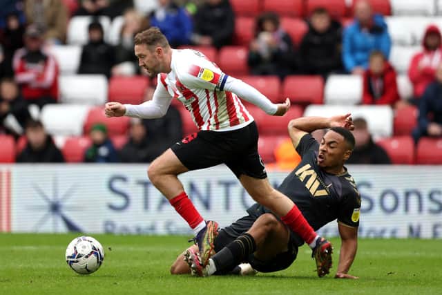 Influential Sunderland winger Aiden McGeady, left, attempts to skip away from Charlton Athletic's Akin Famewo.