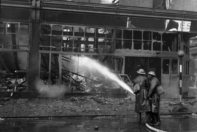 Firefighters tackle a blaze which followed the air raid at Binns in 1941.