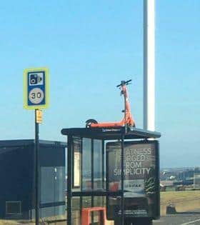 E-scooter parked on top of Seaburn bus shelter