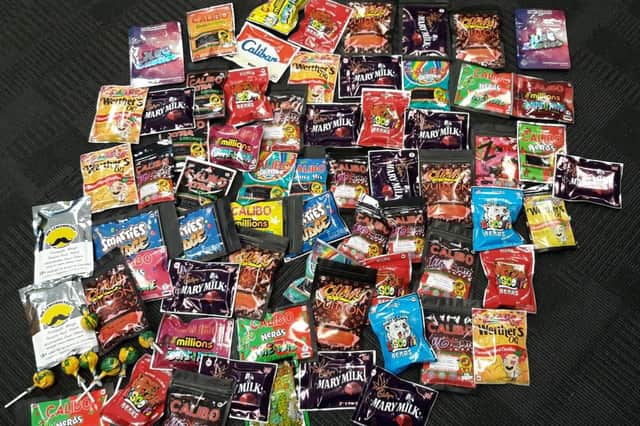 Officers seized psychoactive substances, packaged like sweets, along with £1,000 in cash.