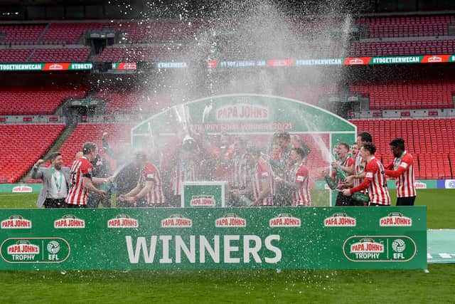 Sunderland players celebrate winning the Papa John's Trophy.