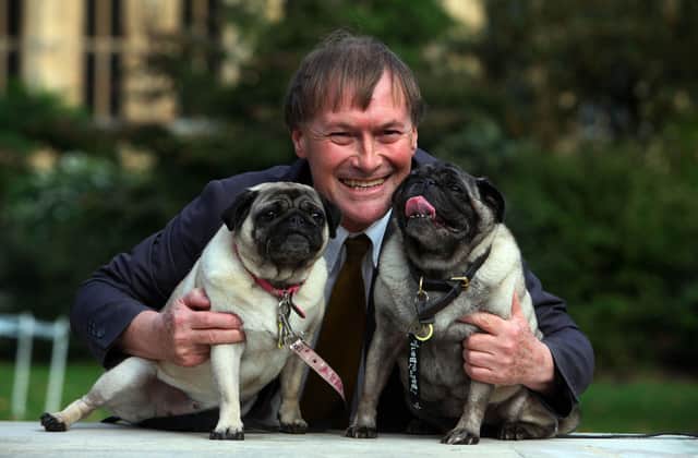 Conservative MP David Amess with his pugs, Lily and Boat. Picture: PA.