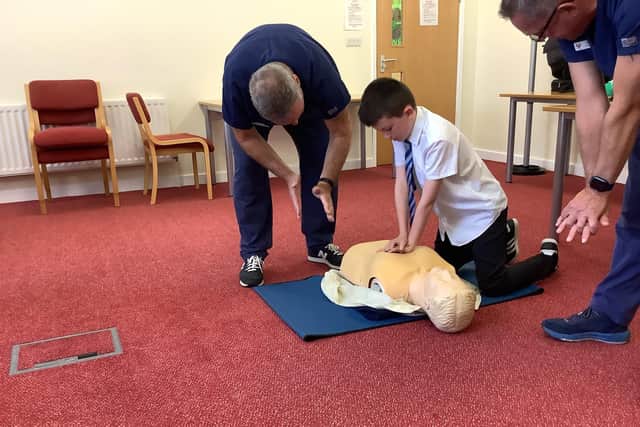 A South Hylton Primary Academy pupil practising delivering CPR.