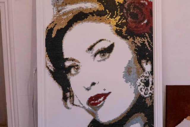 Darren's latest piece is made up of 12,500 screws. Photo: Michael Robbie.