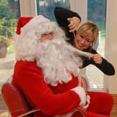 Santa's beard was a little untidy before Susan Hall at Reds helped him out.