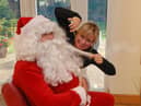 Santa's beard was a little untidy before Susan Hall at Reds helped him out.