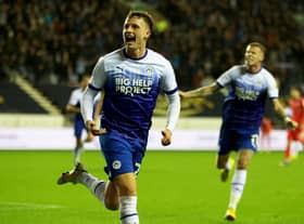WIGAN, ENGLAND - OCTOBER 11: Nathan Broadhead of Wigan Athletic celebrates after scoring their sides first goal during the Sky Bet Championship between Wigan Athletic and Blackburn Rovers at DW Stadium on October 11, 2022 in Wigan, England. (Photo by Clive Brunskill/Getty Images)