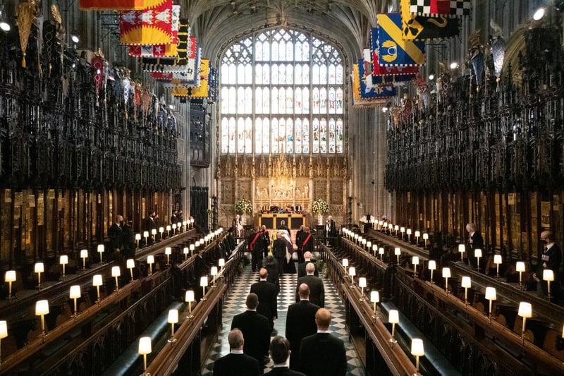 Members of the Royal family, the Princess Royal, the Prince of Wales, the Earl of Wessex, the Duke of York, Peter Phillips, the Duke of Cambridge, the Earl of Snowdon, the Duke of Sussex and Vice Admiral Sir Tim Laurence, follow as the coffin of the Duke of Edinburgh is carried into The Quire during his funeral service at St George's Chapel, Windsor Castle.