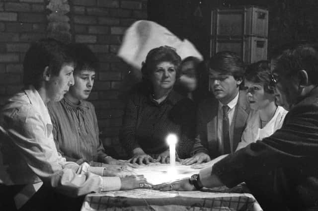 Spiritualist Mrs Ann Bell, centre, with staff of the Top Rank Bingo Hall during their sponsored vigil in the cellar of the hall. Did you take part?