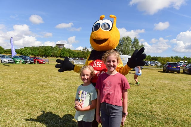 Evelyn and Scarlett Marshall with the Bee Active mascot.
