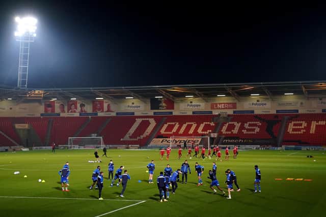 Doncaster players warming up.