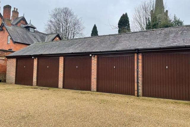One of these double garages, with up-and-over doors and part of a separate block, will belong to the new owners of the Park Mews property for sale.