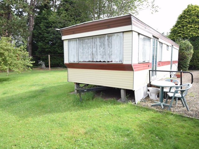 The property includes a static caravan.