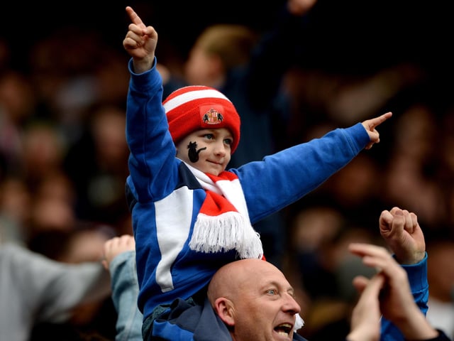 A Sunderland supporter celebrates his team's 3-2 win in the Premier League match between Sunderland and Chelsea at the Stadium of Light on May 7, 2016.
