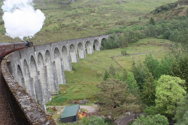 A train on the beautiful Glenfinnan Viaduct - made globally famous by the Harry Potter films.
