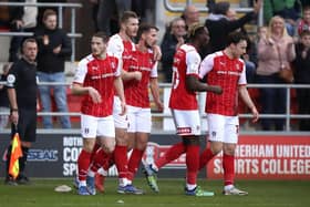 Michael Smith of Rotherham United celebrates with teammates after scoring against Bolton.