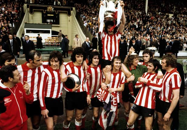 File photo dated 05-05-1973 of Sunderland's captain Bobby Kerr held aloft by his teammates Billy Hughes and goalkeeper Jim Montgomery after their FA Cup Final victory against Leeds United at Wembley Stadium. PA Photo. Issue date: Tuesday May 5, 2020.
