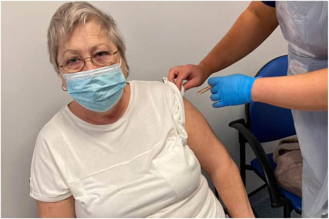 Marion Jolliff receiving her first coronavirus vaccine.