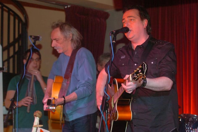 Pete Dodds (centre) and Paul Jackson (right) and other local musicians were pictured in 2010 singing a song about the 'Adelaide' ship at Paddy Whacks,.