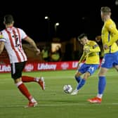 Dan Neil of Sunderland scores the first goal during the Papa John's EFL Trophy Group match between Lincoln City and Sunderland at Sincil Bank Stadium.