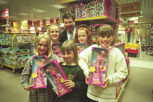 These children were in Joplings where they were collecting Barbie dolls which they won in a Chipper Club competition in 1997.